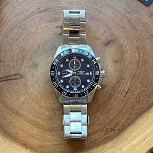 Invicta Black and Silver Watch with Subdials